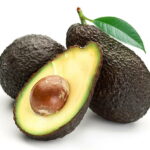 Avocado with leaves on a white background